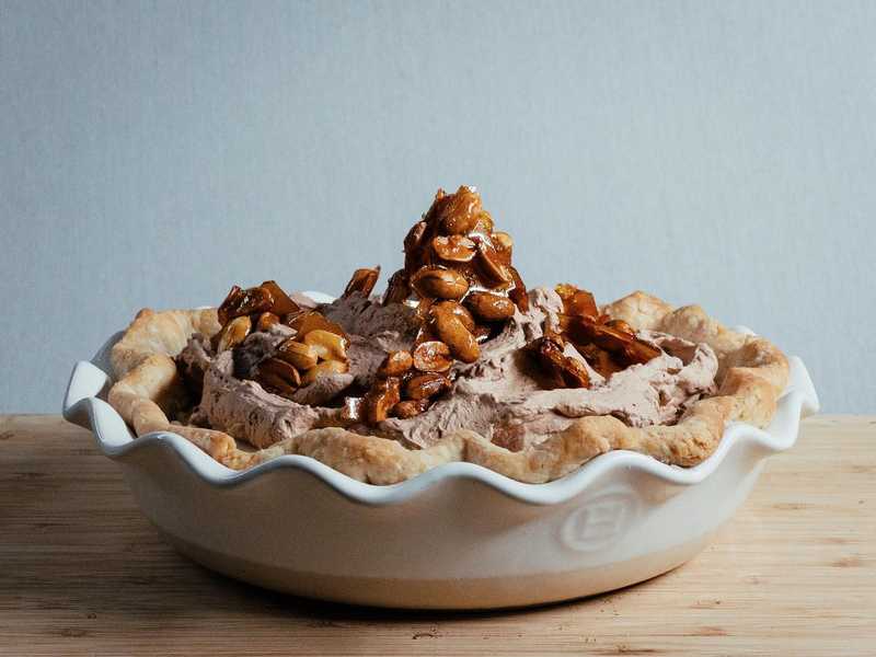 Just in case you thought I would miss pi day… Creamy peanut butter under swoops of chocolate whipped cream. Peanut brittle brings the crunch. 
.
All I had to do was open The Book on Pie from @emcdowell to have a million ideas! 
.
.
.
photo creds - @iktotchi 
#piday #piday2022 #thebookonpie #peanutbutterpie #chocolatewhippedcream #peanutbrittle